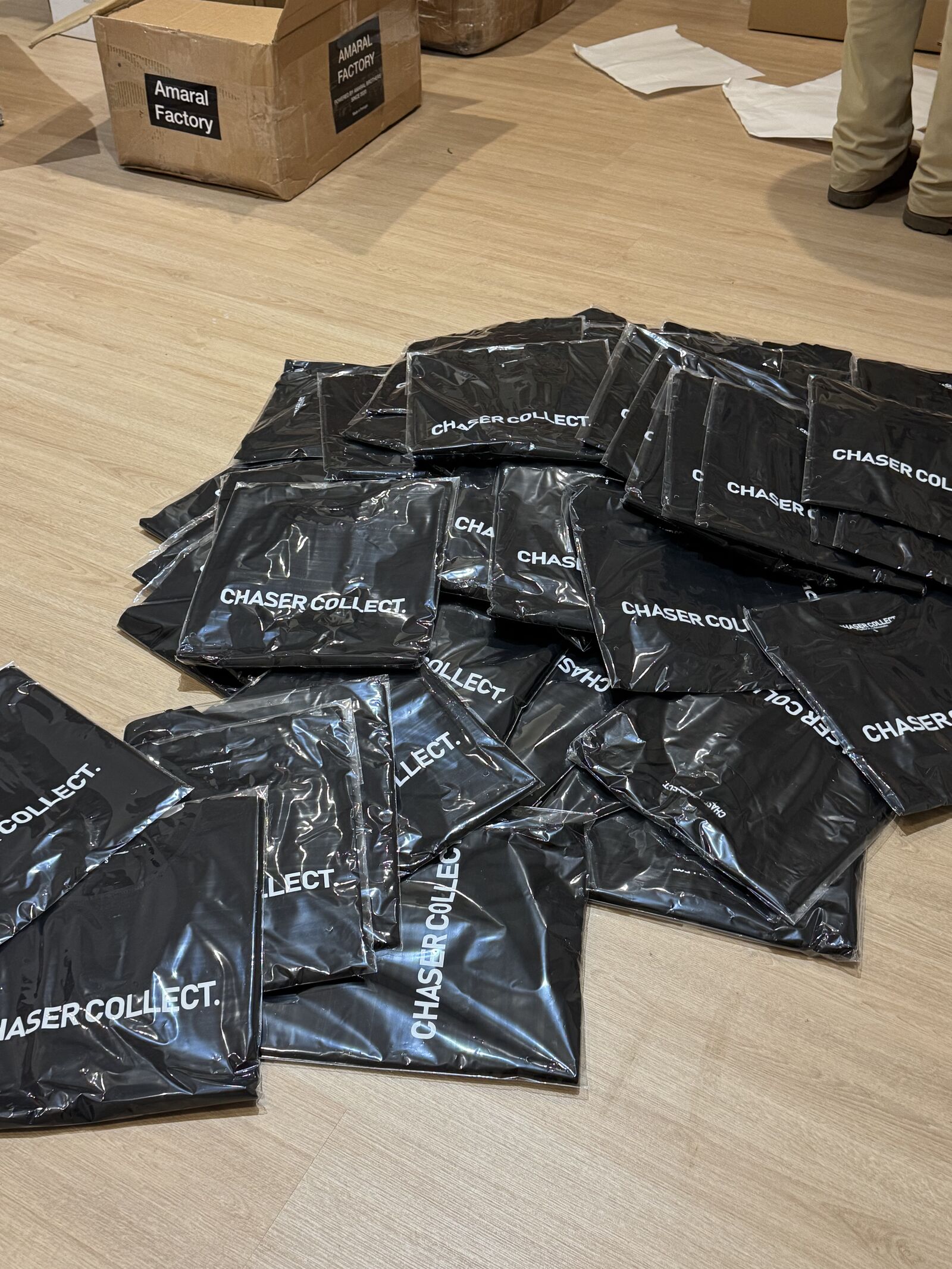 Branded poly mailer bags and shipping boxes ready for fulfillment