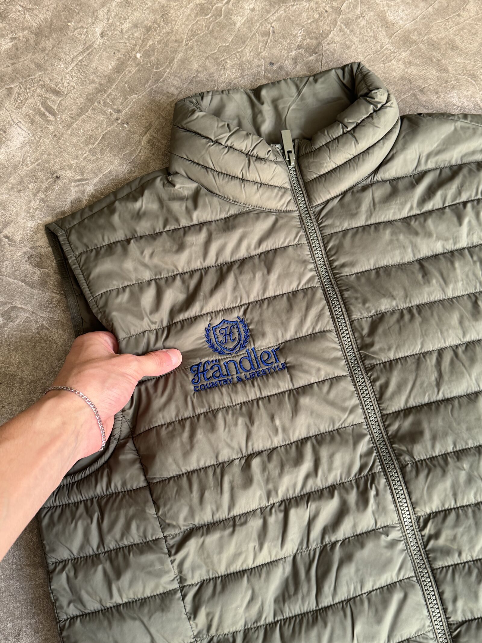 Olive quilted padded jacket with blue embroidered brand logo